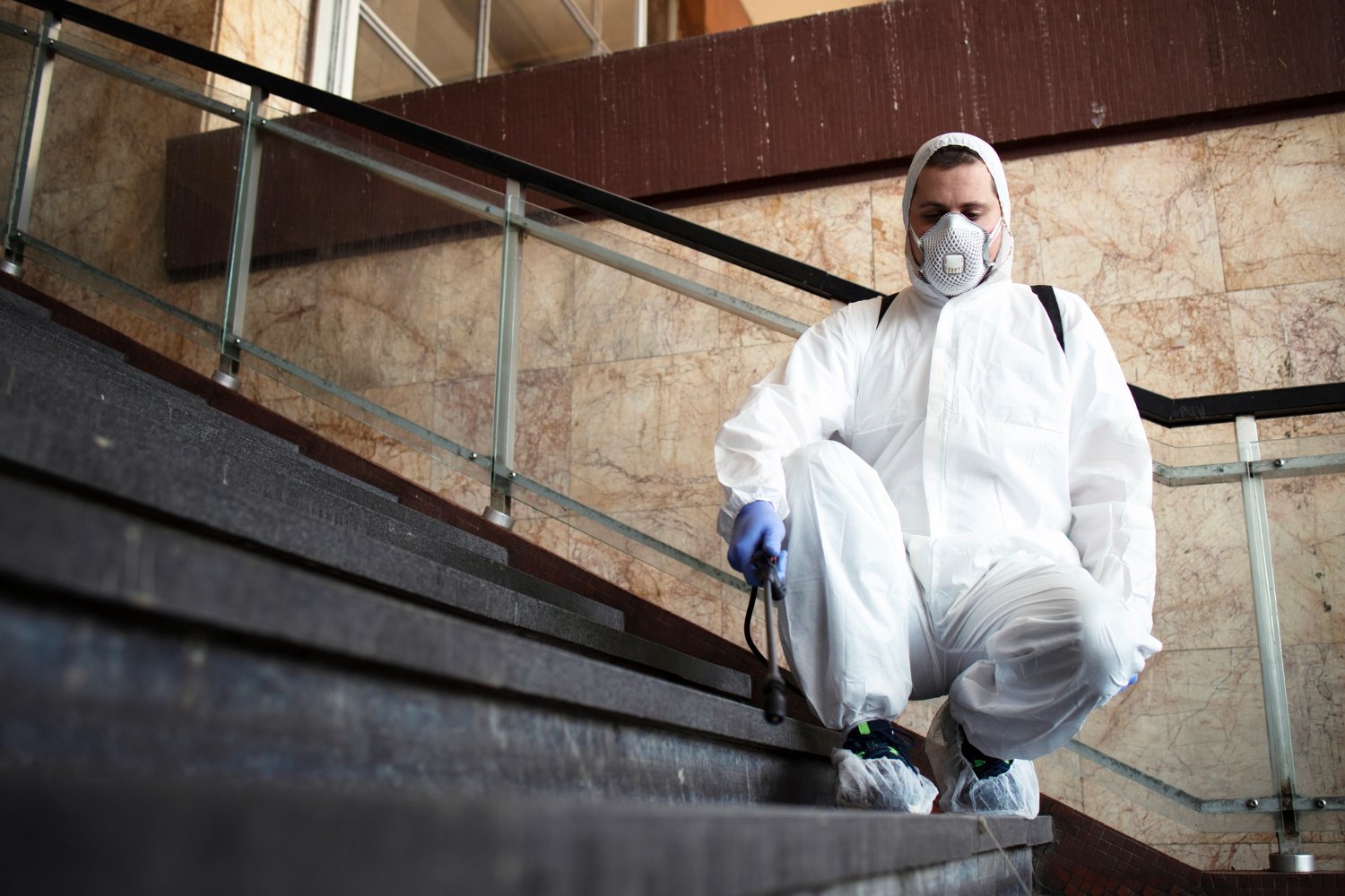 Common Assumptions, Questions, and Answers Regarding Asbestos - hygienist asbestos inspection on stairs