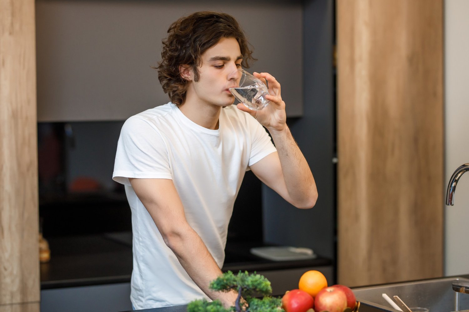Man drinking water - Is Your Drinking Water Safe?