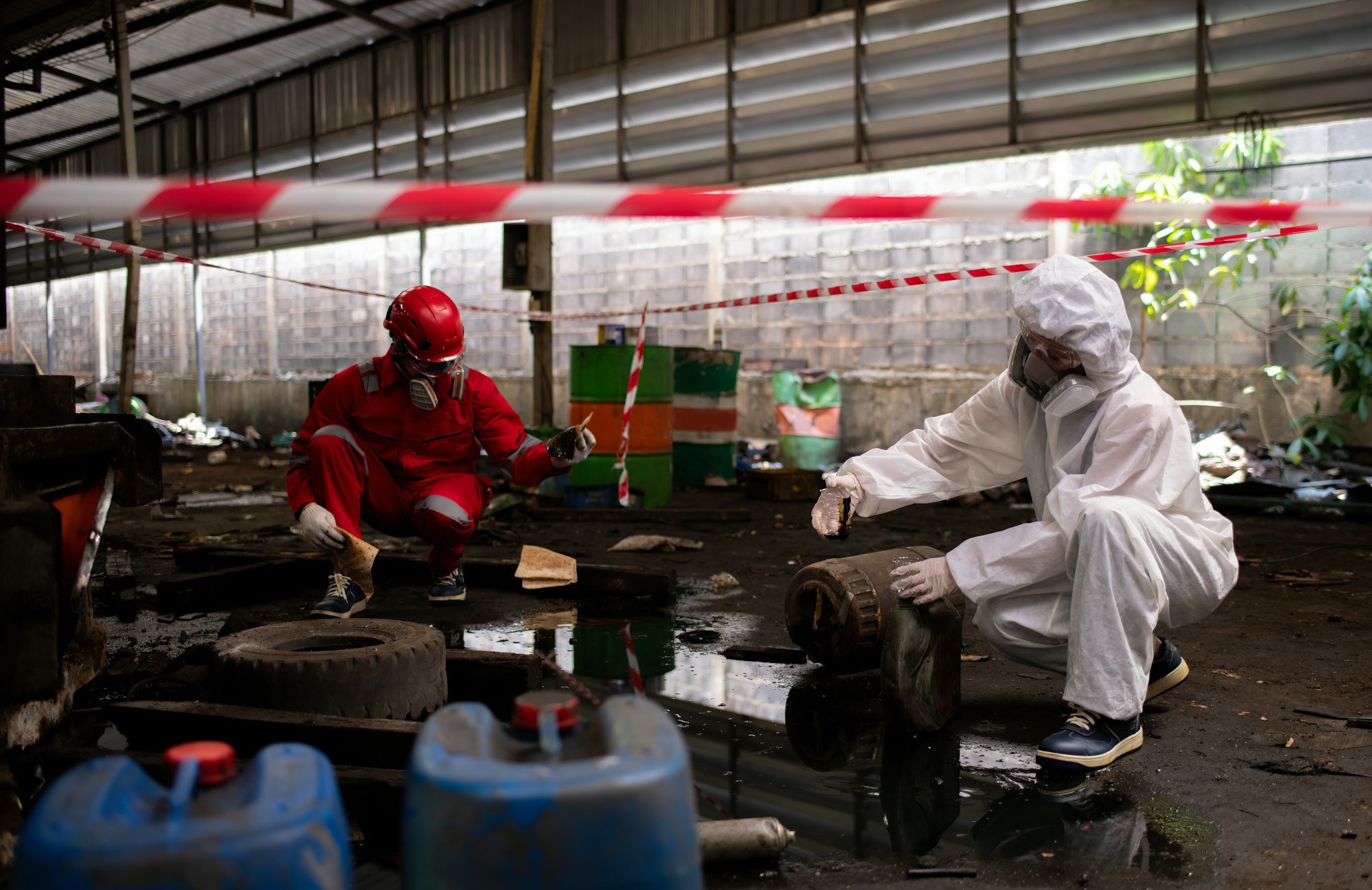 Worker or scientist industry wearing protective safety uniform, white glove and gas mask under clean